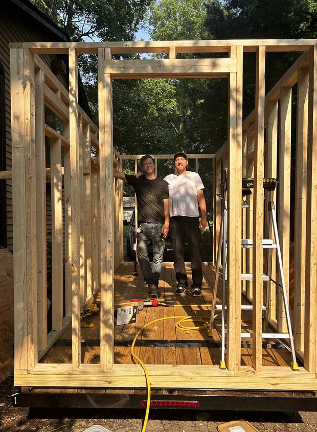 Kenny and Gordy standing in the finished frame