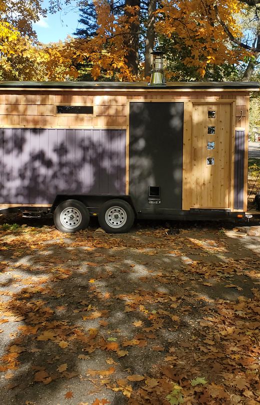The cedar trailer under autumn trees